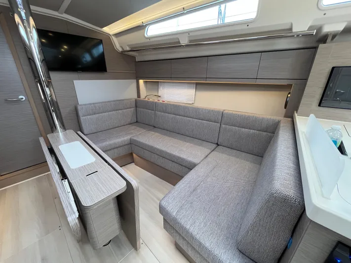 Silver Alert Yacht Photos Pics Modern interior of 2021 Hanse 418 yacht with sleek gray seating and cabinetry.