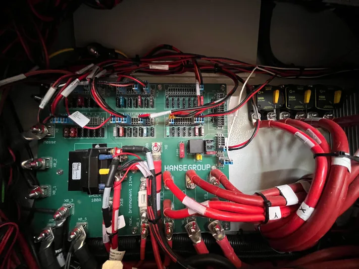 Silver Alert Yacht Photos Pics Electrical panel of a 2021 Hanse 418 yacht with red and black wiring.