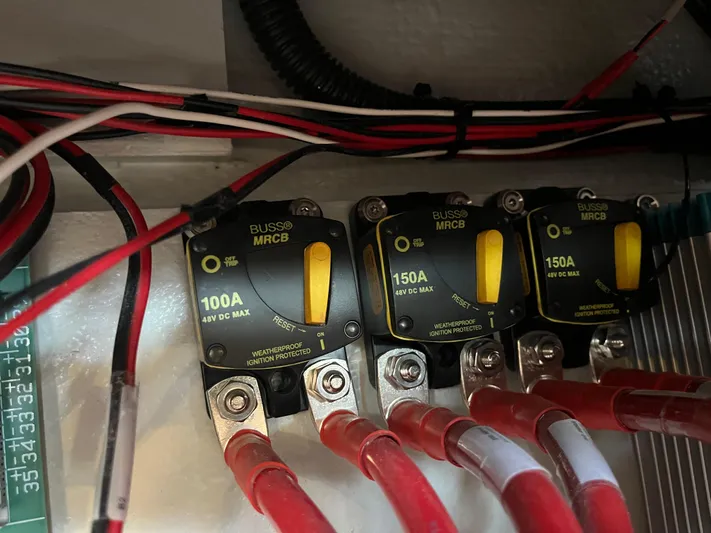 Silver Alert Yacht Photos Pics Electrical circuit breakers on a 2021 Hanse 418 yacht, featuring 100A and 150A ratings.