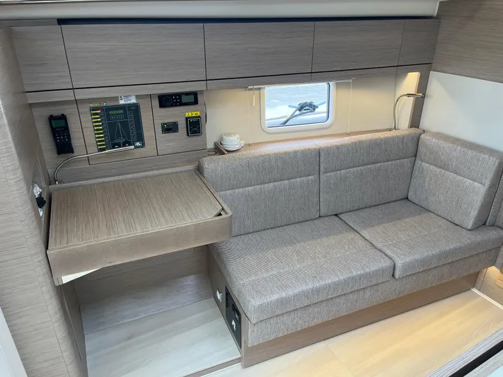Silver Alert Yacht Photos Pics Interior of 2021 Hanse 418 yacht with modern seating and control panel.