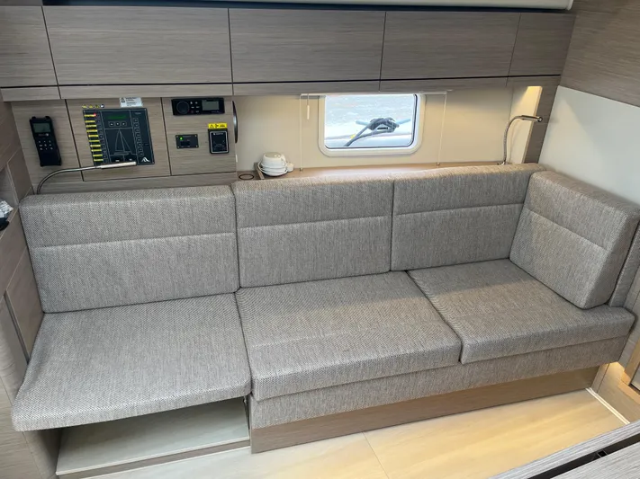 Silver Alert Yacht Photos Pics 2021 Hanse 418 yacht interior with modern gray sofa and control panel.