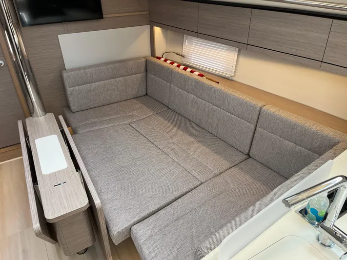 Silver Alert Yacht Photos Pics Modern interior of 2021 Hanse 418 yacht with comfortable seating area.
