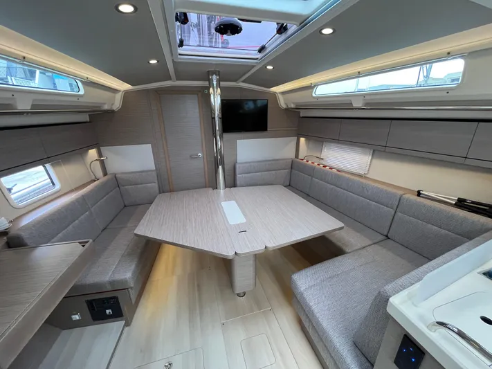 Silver Alert Yacht Photos Pics Modern interior of 2021 Hanse 418 yacht with spacious seating and sleek design.