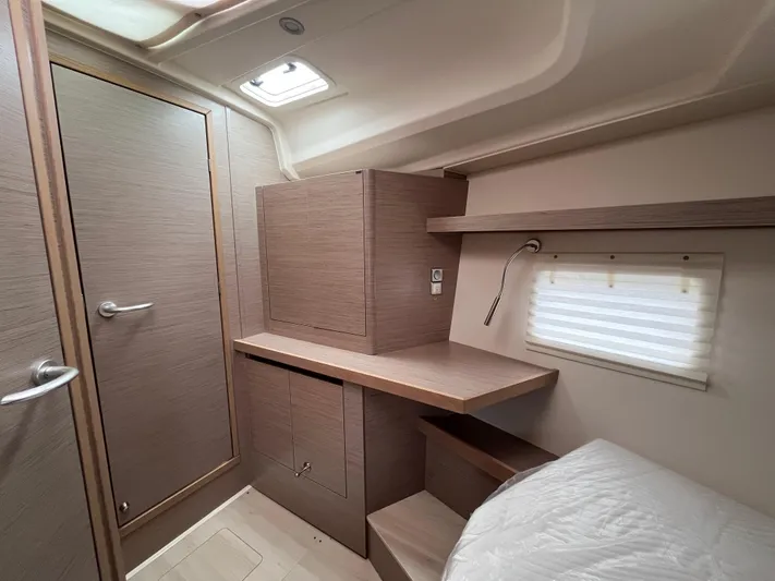 Silver Alert Yacht Photos Pics Interior of 2021 Hanse 418 yacht cabin with modern wood finish and compact design.