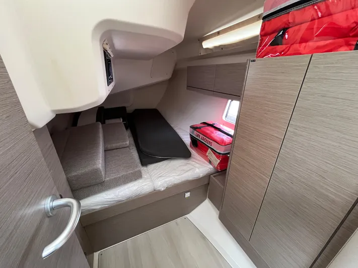 Silver Alert Yacht Photos Pics 2021 Hanse 418 yacht cabin interior with bed, storage, and window.