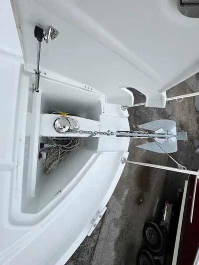  Yacht Photos Pics 2025 Beneteau Antares 8 anchor compartment with chain and anchor visible.