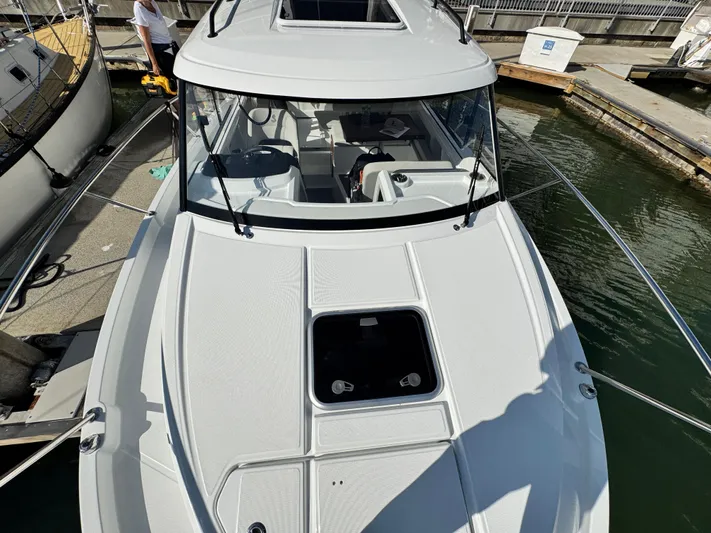 Yacht Photos Pics 2025 Beneteau Antares 8 boat docked, top view of sleek design and spacious deck.