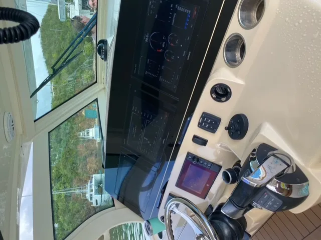 Island Waters Yacht Photos Pics Helm of a 2018 Scout 380 LXF boat with advanced navigation systems.