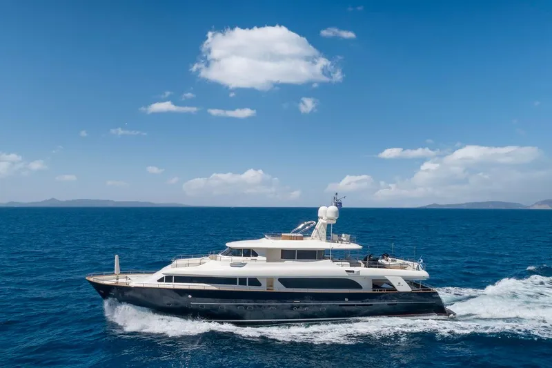 Hag Yacht Photos Pics Luxury yacht Custom Line Navetta 30 cruising on open sea under clear blue sky.