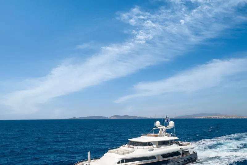 Hag Yacht Photos Pics Luxury yacht Custom Line Navetta 30 cruising on open sea under clear blue sky.