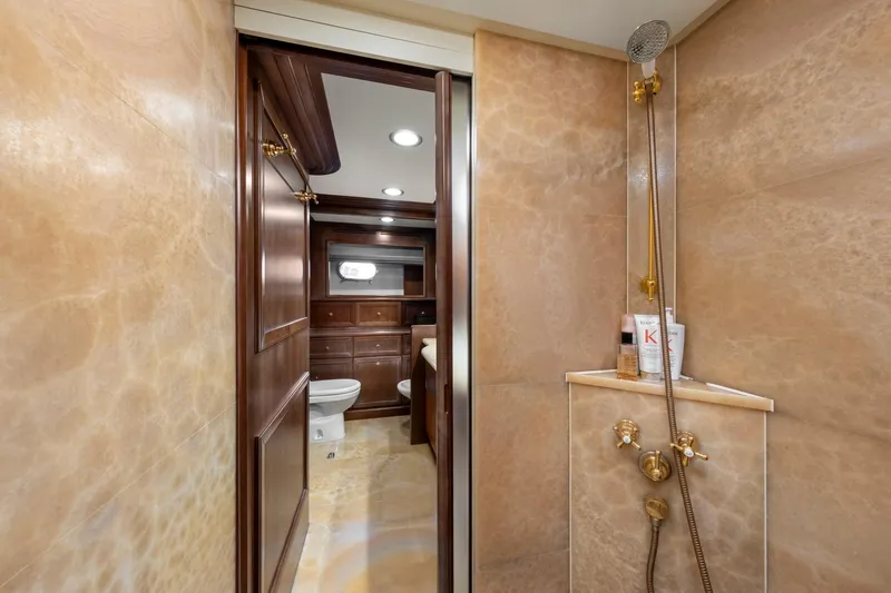 Hag Yacht Photos Pics Luxurious bathroom on 2007 Custom Line Navetta 30 yacht with elegant shower and wooden cabinetry.