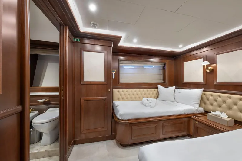 Hag Yacht Photos Pics Luxurious cabin interior of 2007 Custom Line Navetta 30 yacht with elegant wood paneling.