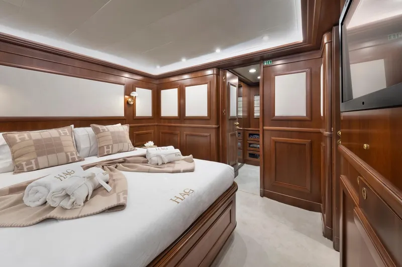 Hag Yacht Photos Pics Luxurious cabin interior of 2007 Custom Line Navetta 30 yacht with elegant wood paneling.