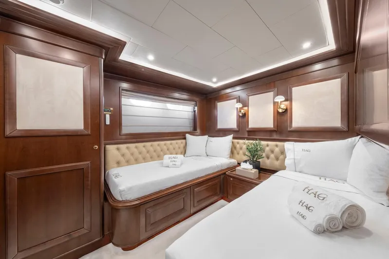 Hag Yacht Photos Pics Luxurious cabin interior of 2007 Custom Line Navetta 30 yacht with elegant wood paneling.