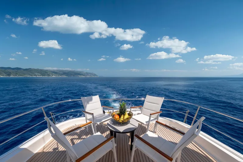 Hag Yacht Photos Pics Luxurious deck view from 2007 Custom Line Navetta 30 yacht, overlooking serene ocean and coastline.