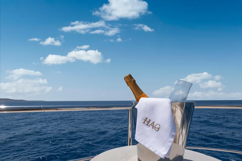 Hag Yacht Photos Pics Champagne on Custom Line Navetta 30 yacht, 2007, with ocean view and blue sky.