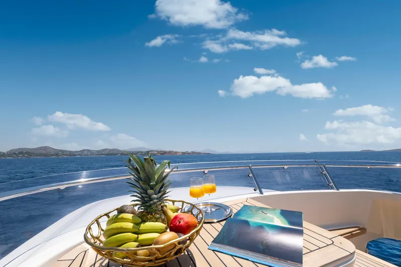Hag Yacht Photos Pics Luxurious 2007 Custom Line Navetta 30 yacht deck with fruit basket and ocean view.