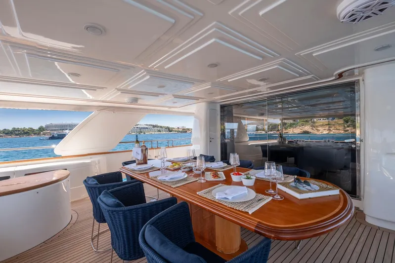 Hag Yacht Photos Pics Luxurious dining area on 2007 Custom Line Navetta 30 yacht, overlooking serene ocean views.