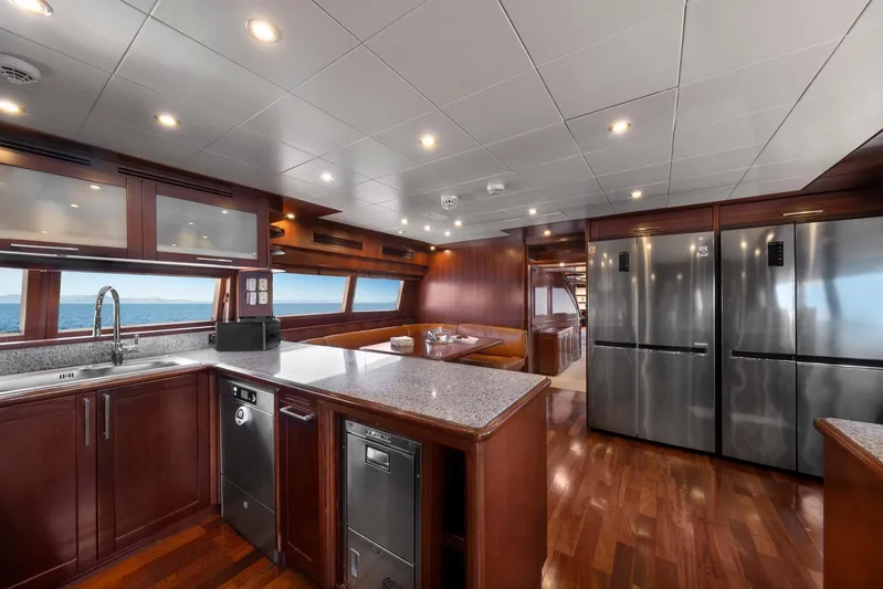 Hag Yacht Photos Pics Luxurious 2007 Custom Line Navetta 30 yacht kitchen with modern appliances and ocean view.