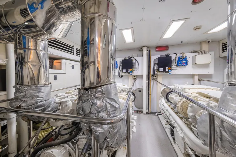 Hag Yacht Photos Pics Engine room of 2007 Custom Line Navetta 30 yacht with polished metal pipes.