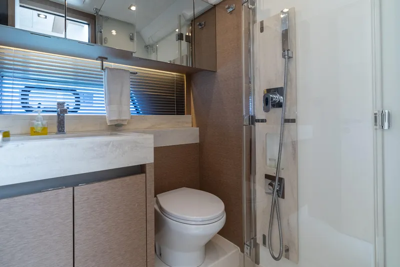 Motivated Seller Yacht Photos Pics Luxurious bathroom in 2019 Prestige 520 yacht with modern fixtures and elegant design.