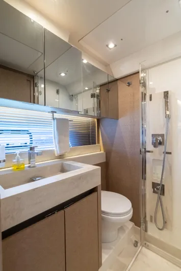 Motivated Seller Yacht Photos Pics Luxurious bathroom in 2019 Prestige 520 yacht with modern fixtures and glass shower.