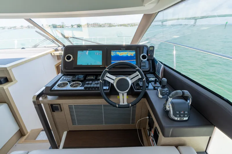 Motivated Seller Yacht Photos Pics Helm station of 2019 Prestige 520 yacht with dual displays and navigation controls.