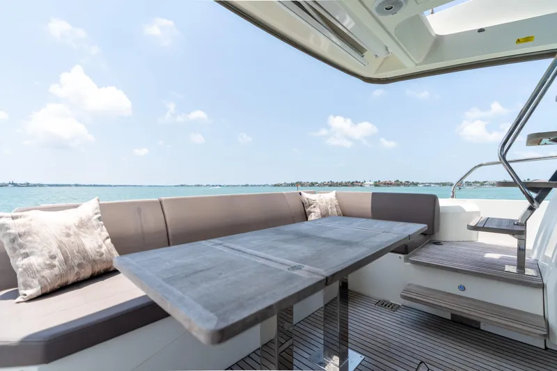 Motivated Seller Yacht Photos Pics Luxurious seating area on 2019 Prestige 520 yacht with ocean view.