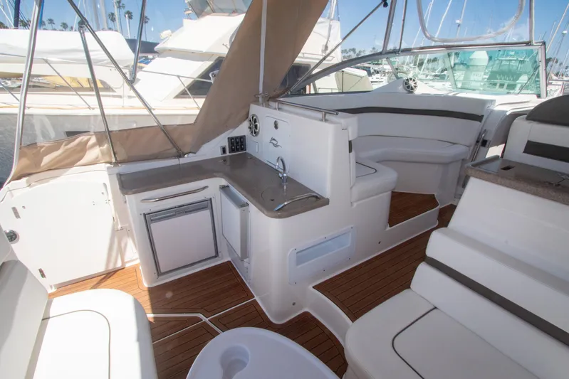 No Name Yacht Photos Pics 2008 Rinker 400 Express Cruiser interior with kitchenette and seating area.