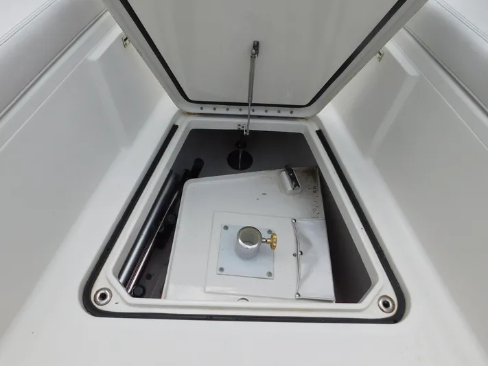  Yacht Photos Pics 2013 Hydra-Sports 4200 Siesta storage compartment with open hatch, showcasing interior details.