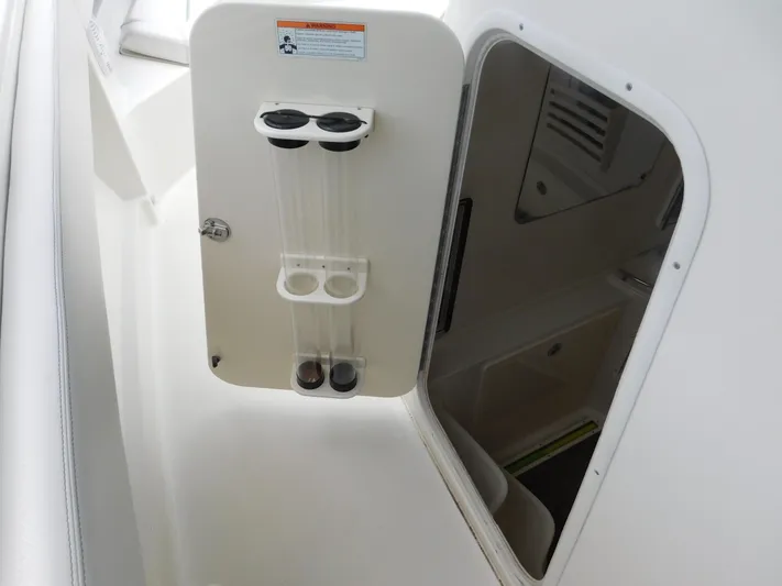  Yacht Photos Pics 2013 Hydra-Sports 4200 Siesta boat compartment with open hatch and storage tubes.