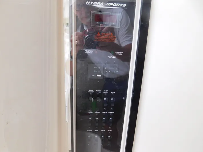  Yacht Photos Pics Control panel of a 2013 Hydra-Sports 4200 Siesta boat, featuring various switches and displays.