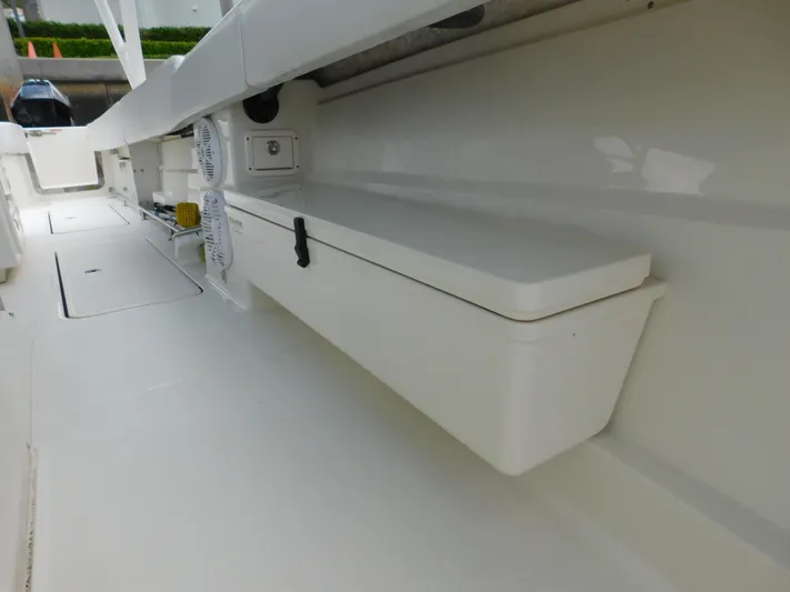  Yacht Photos Pics 2013 Hydra-Sports 4200 Siesta boat interior with storage compartment and clean white finish.