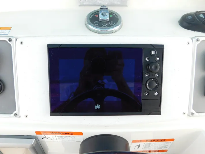  Yacht Photos Pics Control panel of 2013 Hydra-Sports 4200 Siesta boat with navigation display.