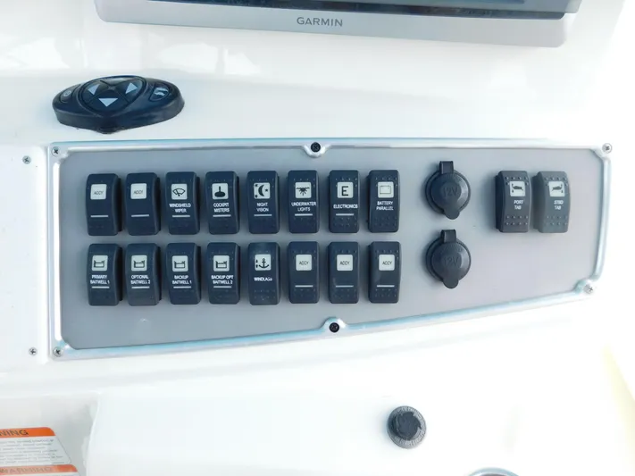  Yacht Photos Pics Control panel of a 2013 Hydra-Sports 4200 Siesta boat with labeled switches and buttons.