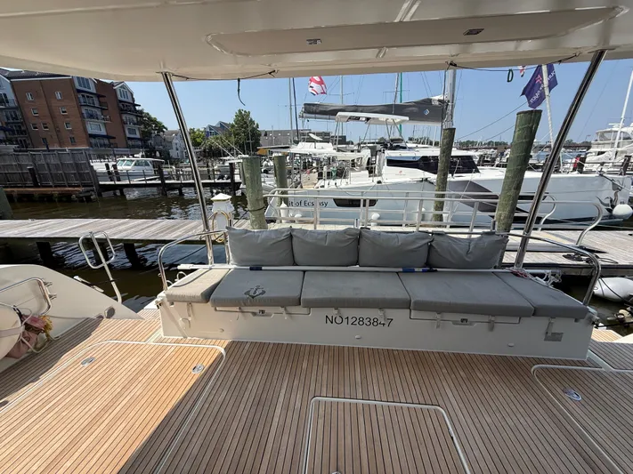 A New Hope Yacht Photos Pics Fountaine Pajot MY 44 yacht deck with seating, docked at marina, 2018 model.
