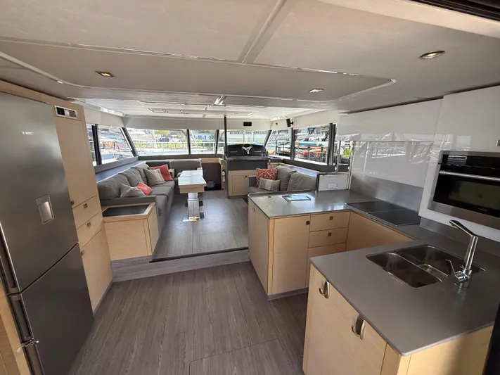A New Hope Yacht Photos Pics Luxurious interior of 2018 Fountaine Pajot MY 44 yacht with modern kitchen and seating area.