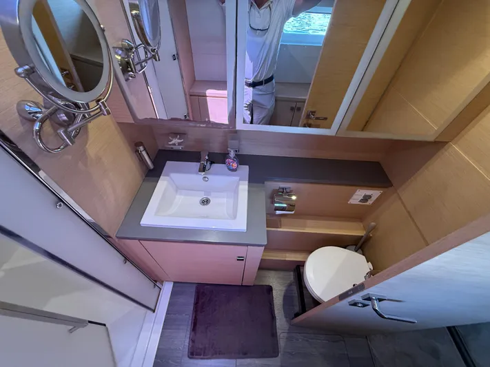 A New Hope Yacht Photos Pics Bathroom interior of 2018 Fountaine Pajot MY 44 yacht, featuring sink and toilet.