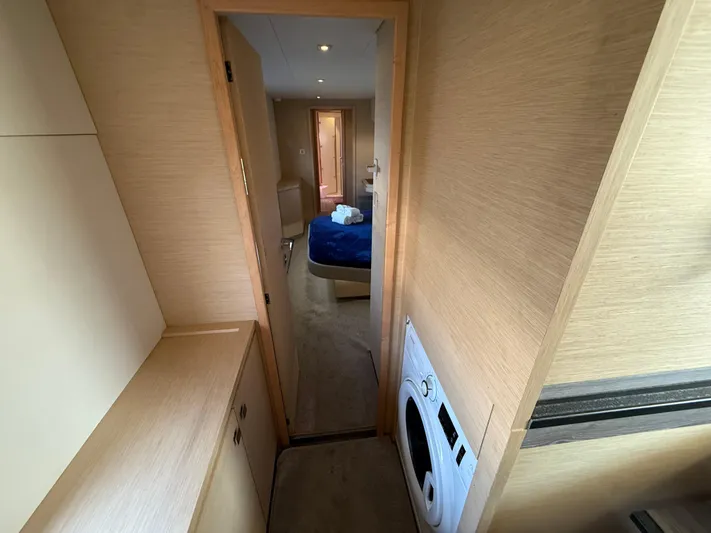 A New Hope Yacht Photos Pics Interior of 2018 Fountaine Pajot MY 44 yacht with modern wood finish and laundry area.