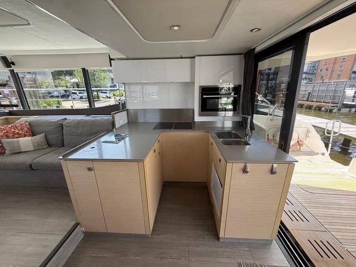 A New Hope Yacht Photos Pics Modern kitchen interior on 2018 Fountaine Pajot MY 44 yacht, featuring sleek design and ample natural light.