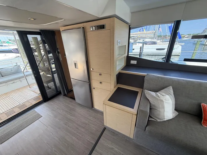 A New Hope Yacht Photos Pics Interior of 2018 Fountaine Pajot MY 44 yacht with modern kitchen and seating area.