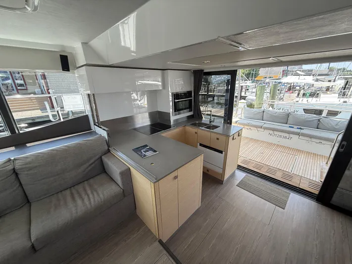 A New Hope Yacht Photos Pics Modern interior of 2018 Fountaine Pajot MY 44 yacht with sleek kitchen and cozy seating.