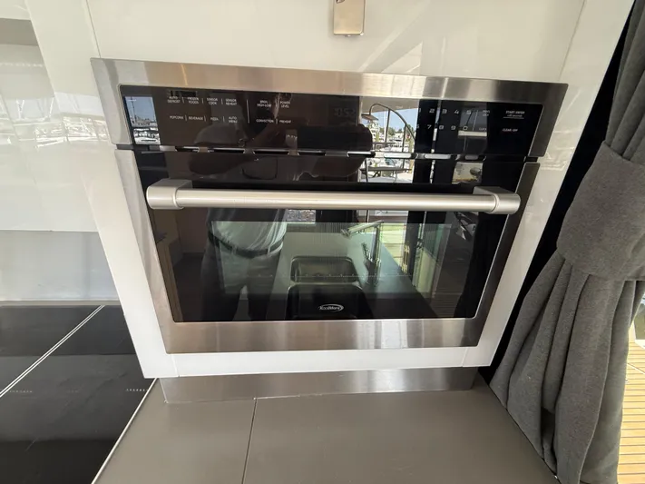 A New Hope Yacht Photos Pics Built-in oven on 2018 Fountaine Pajot MY 44 yacht, featuring sleek stainless steel design.