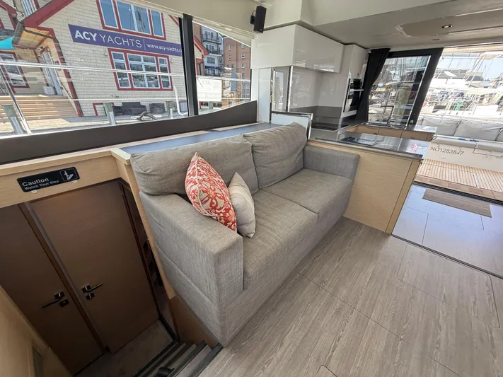 A New Hope Yacht Photos Pics Interior of 2018 Fountaine Pajot MY 44 yacht with modern sofa and kitchen area.