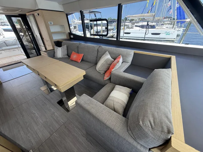 A New Hope Yacht Photos Pics Luxurious interior of 2018 Fountaine Pajot MY 44 yacht with modern seating and table.