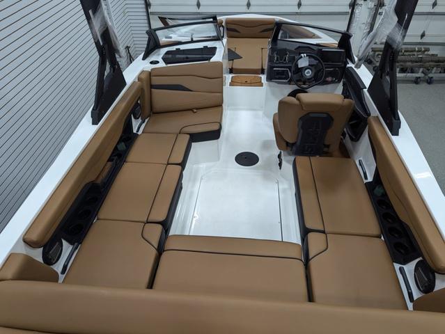 2025 Axis Wake Research T220 boat interior with tan seating and modern dashboard.