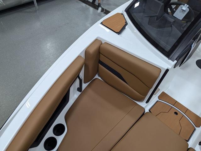 2025 Axis Wake Research T220 boat interior with tan seating and cup holders.