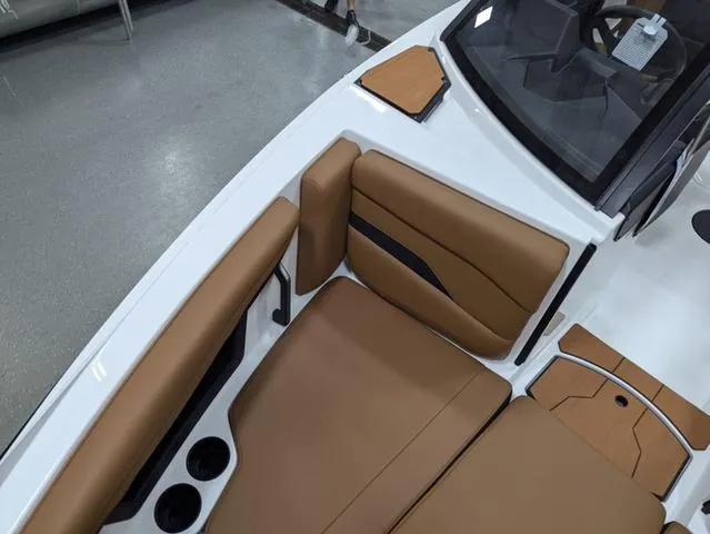 2025 Axis Wake Research T220 boat interior with tan seating and cup holders.