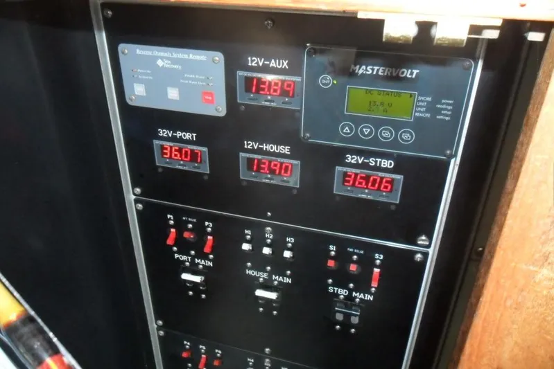  Yacht Photos Pics Electrical control panel on a 1979 Bertram 46.6 Sport Fisher boat, displaying voltage readings.
