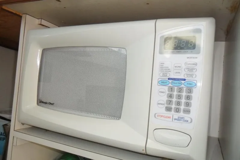  Yacht Photos Pics Magic Chef microwave with digital display and control panel in a kitchen setting.